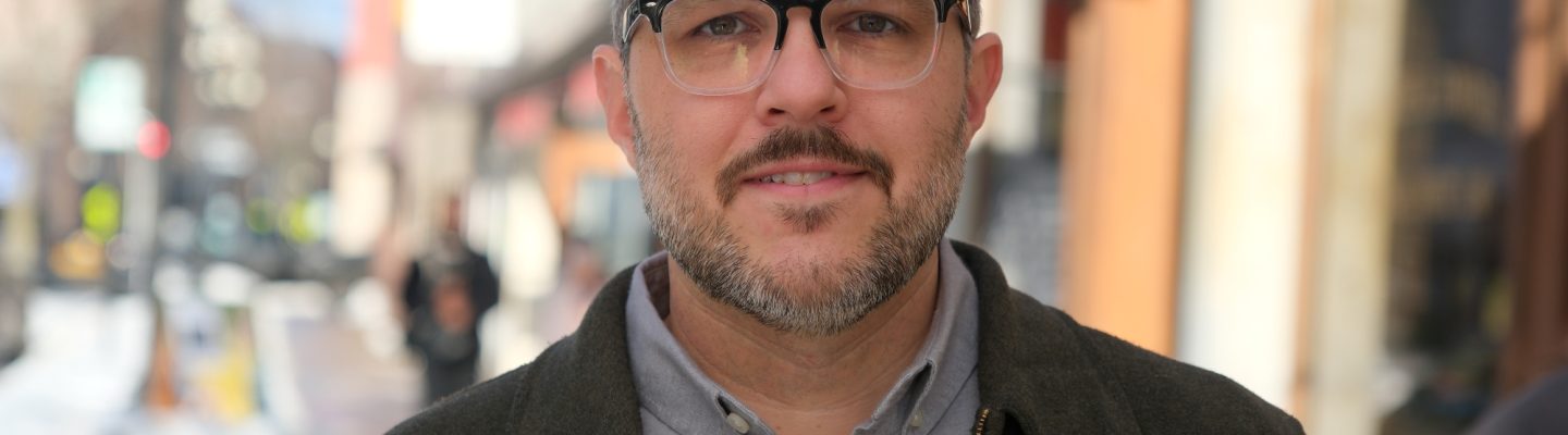 a photo of Scott Harriman, candidate for Maine House 94, on the street in Lewiston