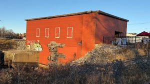 a photo of the red shop glowing in the afternoon sun